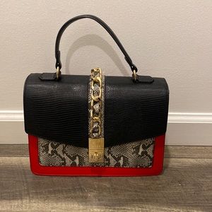 Aldo black,red, snakeskin purse with gold chain hardware